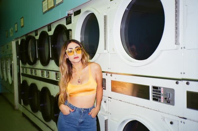 Jessica Delijani, aka Disco Shrine, blends together sparkling melodies and somber lyrics so effortlessly. She’s a renowned DJ, and a powerful voice for immigrants, especially during this difficult time in America. We talked about the moving story behind her song “Up In The Air” and the follow-up