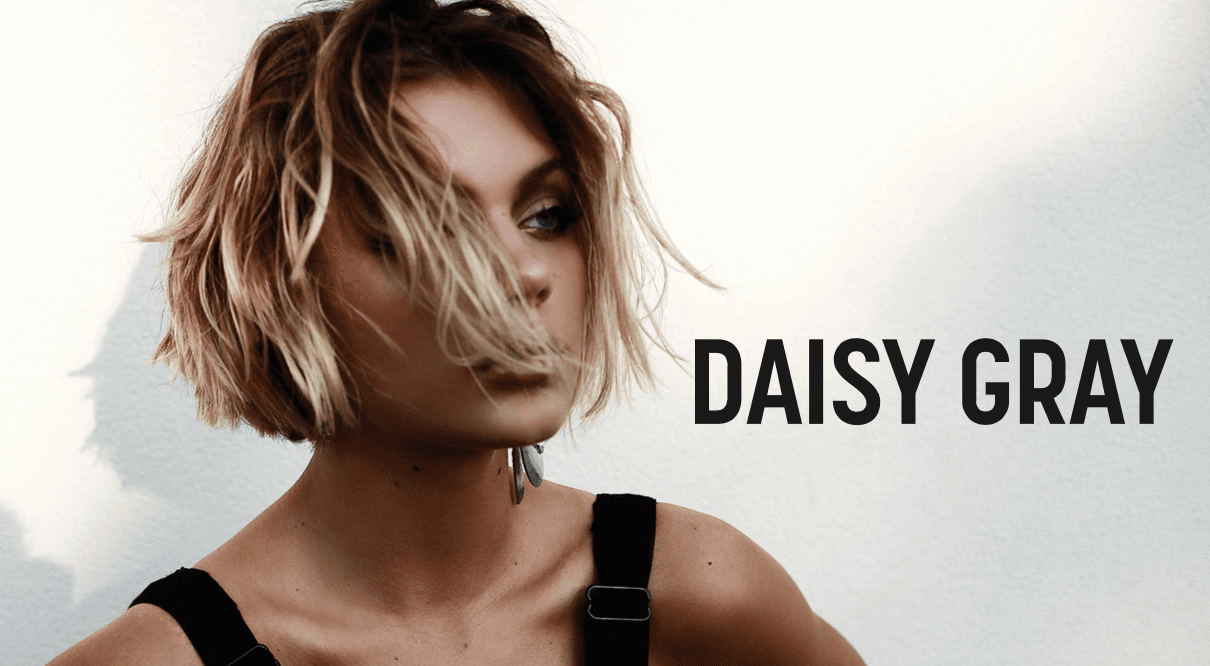 Daisy Gray’s new video for “About You” checks off all our boxes: glam looks, late night drives, dive bars. We’re here for it.